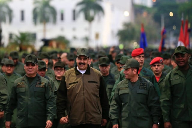 Maduro rallies military as Venezuela opposition appeals to troops