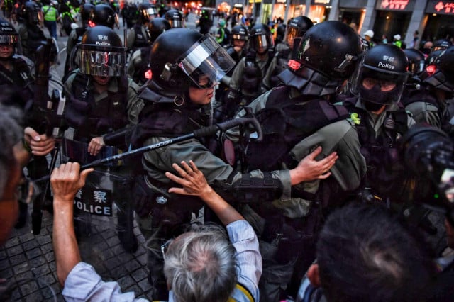 Hong Kong protesters target trains, urge general strike