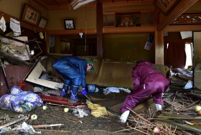 Clean-up, rescue efforts in Japan as typhoon toll nears 70