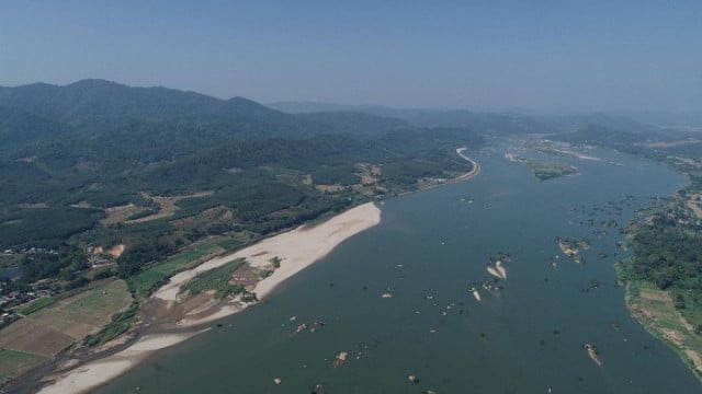 Low flows turn Mekong aquamarine hue in Laos and Thailand