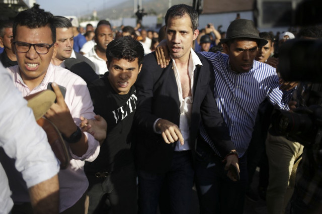Venezuela opposition leader Guaido returns home, fighting erupts