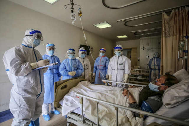 China reports 22 new virus deaths as imported cases rise