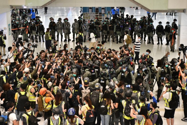 China warns Hong Kong protesters against 'stirring up trouble'