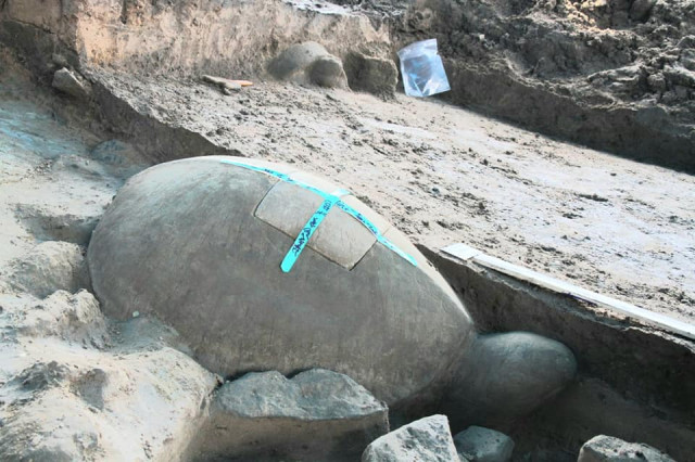 Archeologists unearth another centuries-old tortoise statue at Cambodia's famed Angkor reservoir