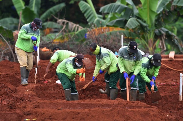 Indonesia's gravediggers battle virus fears, stigma