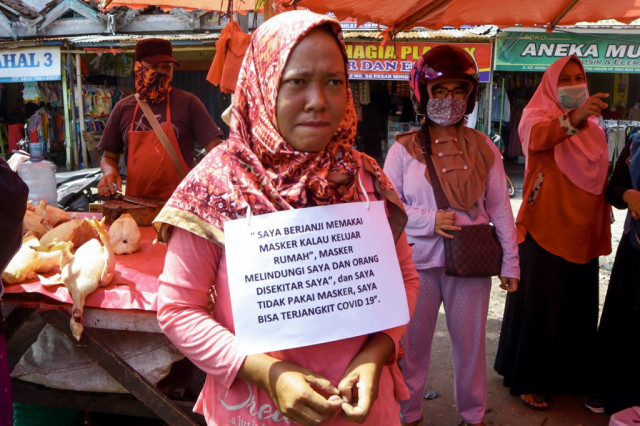 Indonesia rolls out public shaming for virus violators