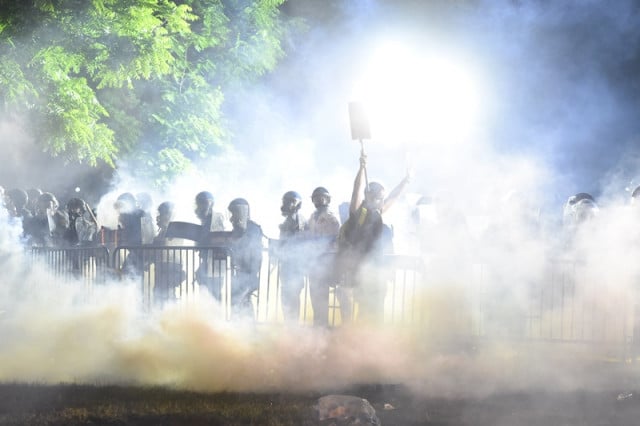 Clashes outside White House as US cities under curfew