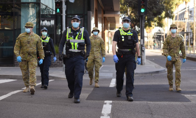 Global virus cases top 18 million as Australian city imposes curfew