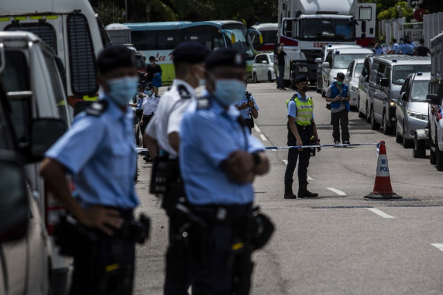 Hong Kong police raid pro-democracy newspaper, arrest owner