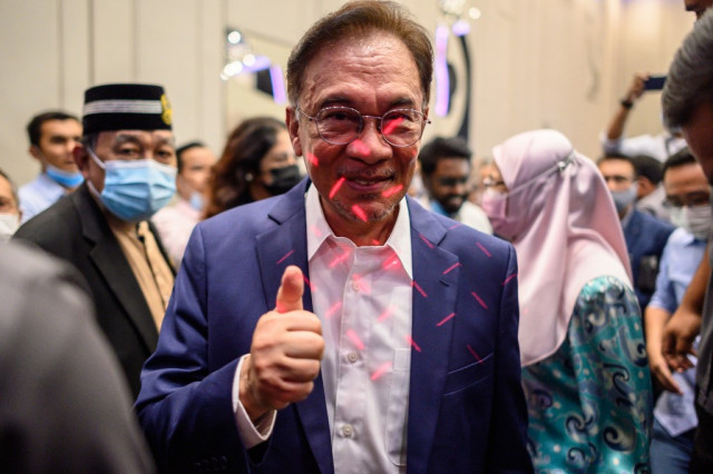 Malaysia's Anwar says has backing to form govt, PM unshaken