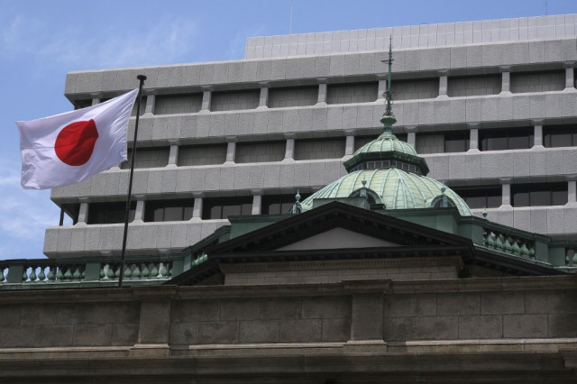 Bank of Japan cuts growth outlook, holds monetary policy