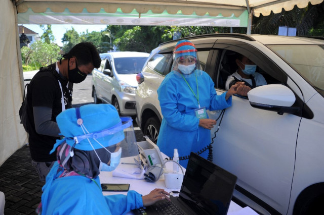 Bali kicks off drive-thru virus jabs for hospitality workers