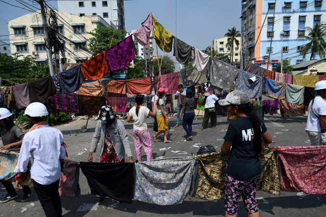 Women's clothes help protesters skirt Myanmar's junta