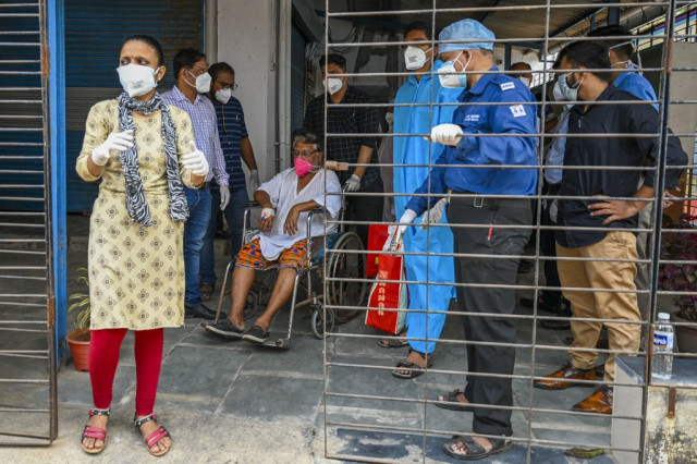 India hospitals overwhelmed by virus as Japan declares emergency