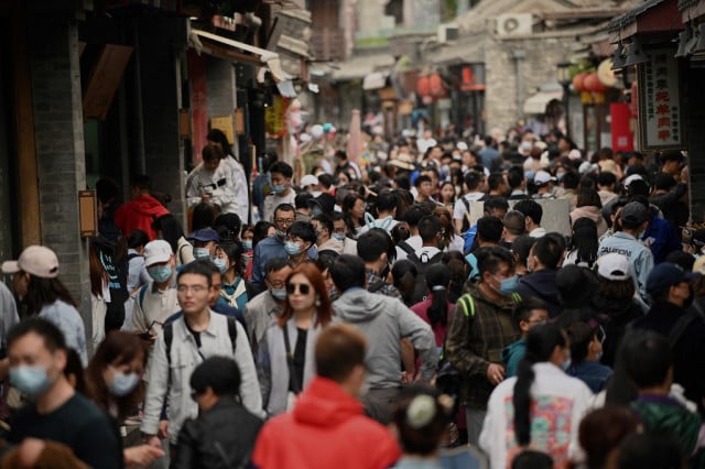 Chinese tourists out in force as virus fears recede