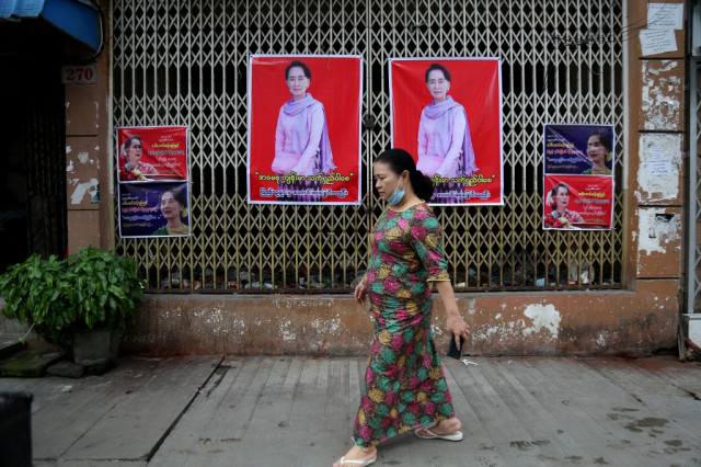 Myanmar protesters wear flowers to mark Suu Kyi's birthday