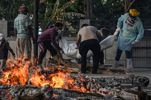 India hits 400,000 virus deaths as vaccinations slow