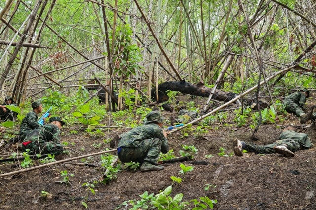 Myanmar rebel group suspends key leader in massacre investigation