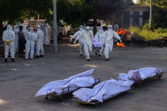 'Dead body carrier': Covid surge overwhelms Myanmar burial volunteers