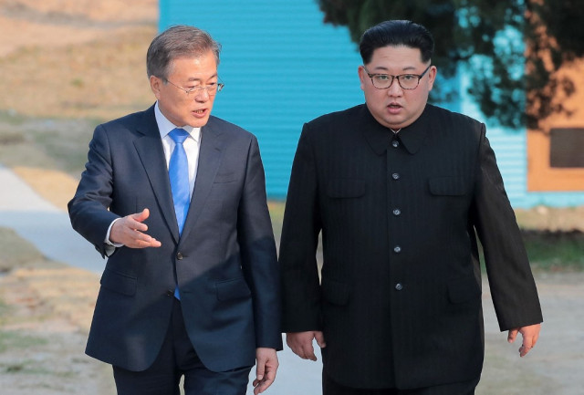 Two Koreas restore severed communications in surprise thaw
