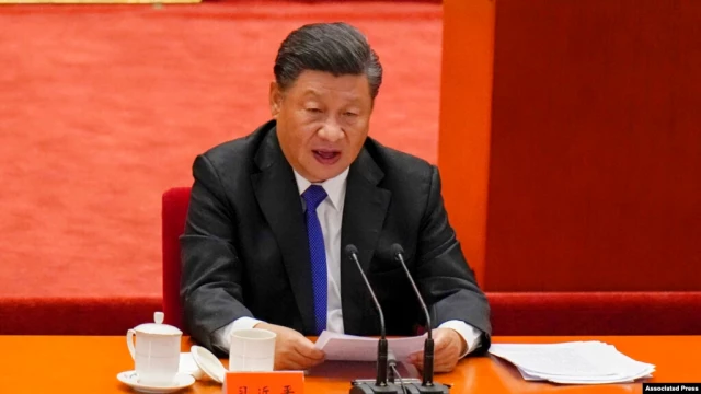 China's Xi Vows 'Reunification' with Taiwan, but Holds Off Threatening Force