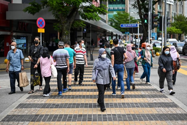 Malaysia eases travel curbs as Covid outbreak slows