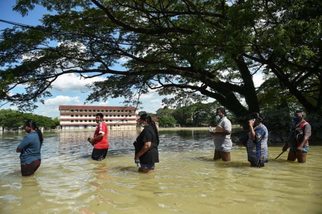 14 dead, 70,000 displaced in Malaysian floods