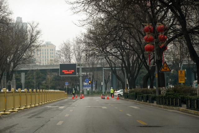 China locks down city of 1.2 million after three virus cases