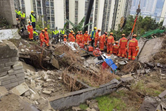 At least 20 trapped after blast causes building collapse in China