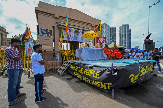 Crisis-hit Sri Lanka lifts curfew for Buddhist festival