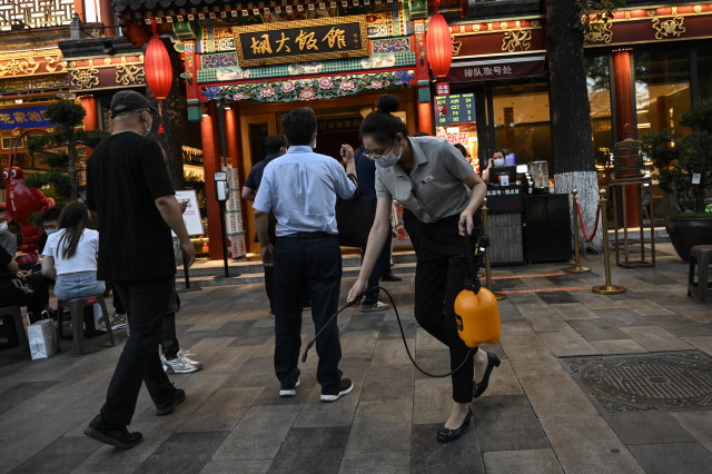 Relief, caution in Beijing as city lifts Covid dine-in curbs