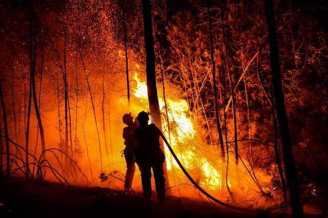 Firefighters contain 'mega-fire' in southern France