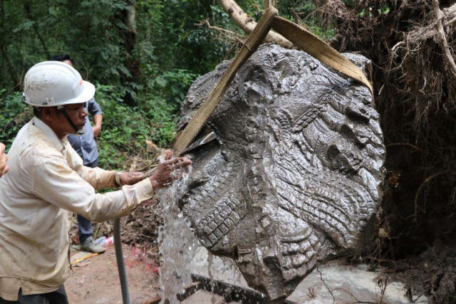 Centuries-old sandstone naga's head unearthed in Cambodia's famed Angkor Park