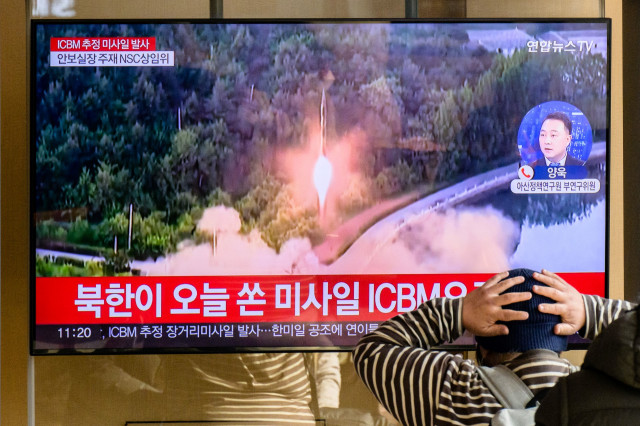 Kim oversees N. Korea's ICBM launch with daughter in tow