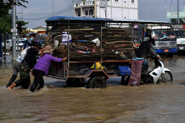 Flood and Inflation Victims Get Cash Aid