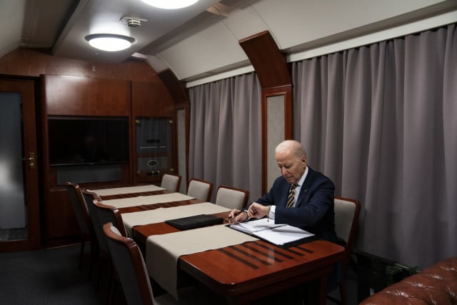 Darkened plane, silent overnight train: how Biden got to Kyiv