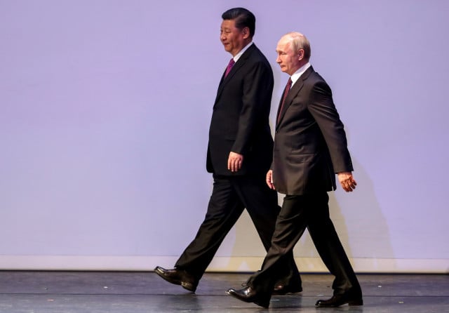 Ukraine watches anxiously as China's Xi visits Kremlin