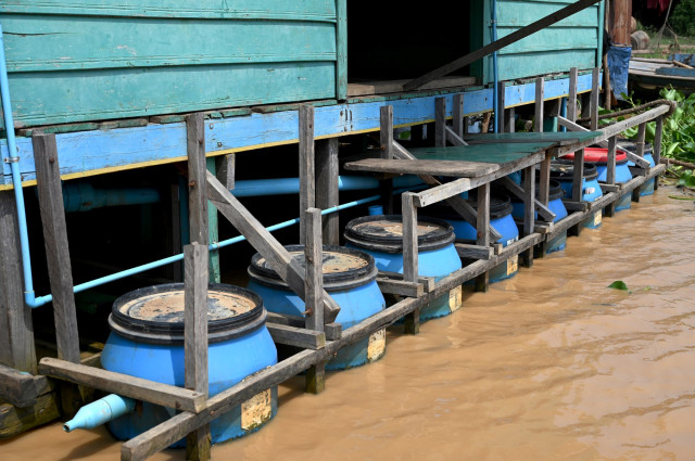 'Floating toilets' help Cambodia's lake-dwelling poor