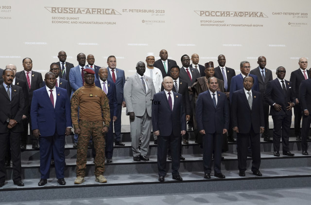 Putin woos African leaders at a summit in Russia with promises of expanding trade and other ties