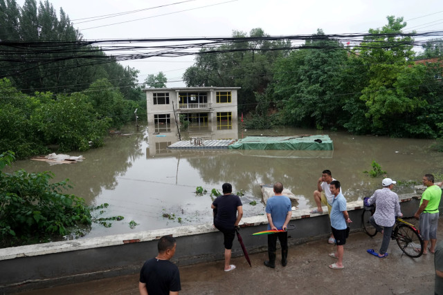 Military Helicopters Deliver Aid to Beijing Flood Victims