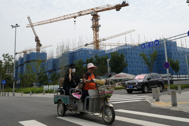 China's Government Tries to Defuse Economic Fears after Real Estate Developer's Debt Struggle